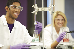 College students in lab conducting titrations